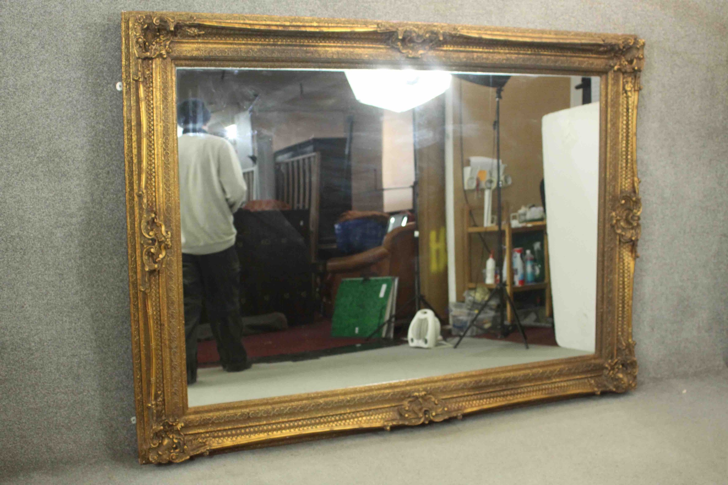 A large and decoratively framed gilt pier mirror in the Rococo style. H.160 W.220cm. - Image 8 of 9