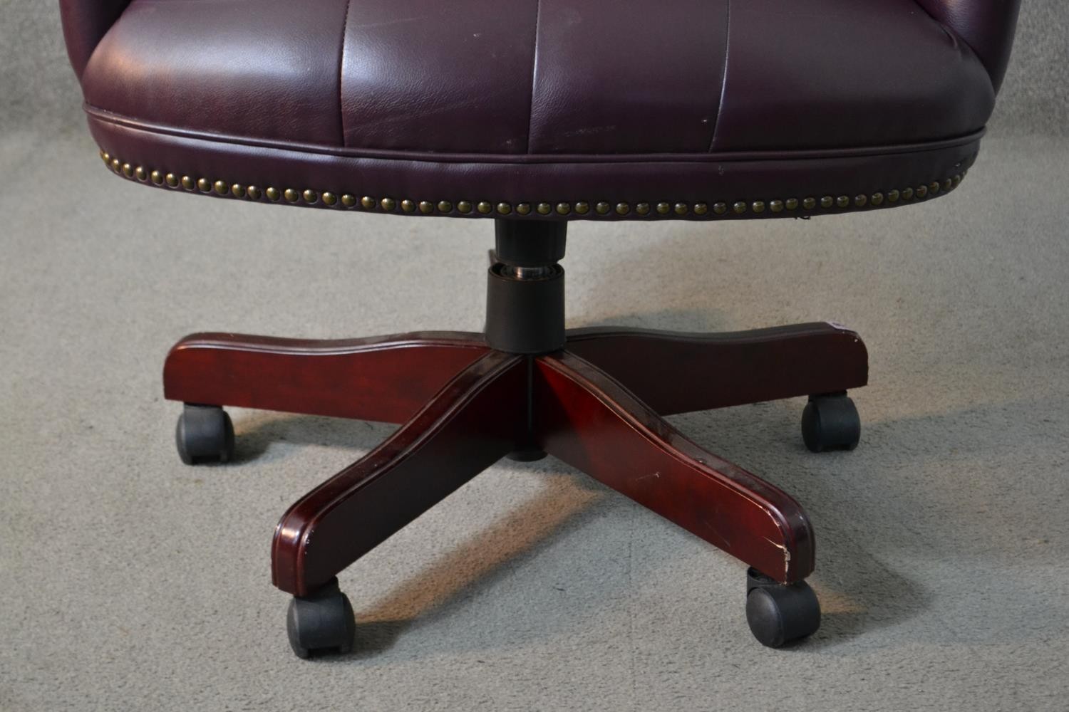 A 20th century wing back swivel office chair, upholstered in burgundy leather, with buttoned back - Image 9 of 13