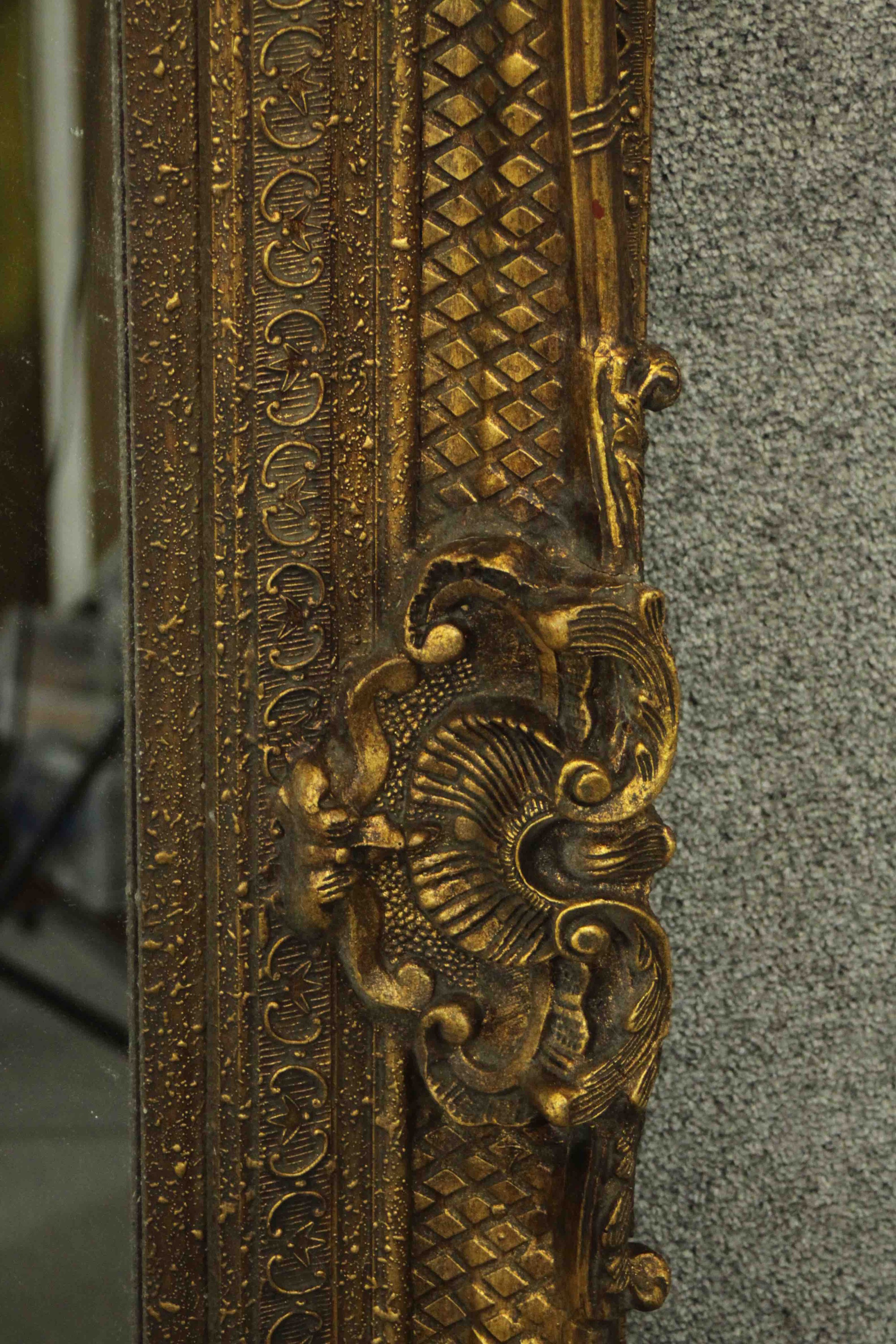 A large and decoratively framed gilt pier mirror in the Rococo style. H.160 W.220cm. - Image 7 of 9