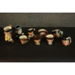 A collection of nine hand-painted Toby jugs, makers marks to the bases. H.16 W.14cm. (largest)