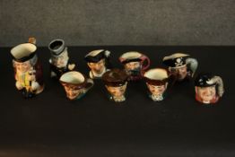 A collection of nine hand-painted Toby jugs, makers marks to the bases. H.16 W.14cm. (largest)