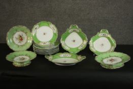 A 19th century hand-painted and gilded porcelain green and floral design part dinner service for
