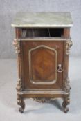 A 19th century Italian walnut bedside cabinet, with a marble top, over a missing drawer, above a