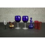 A collection of 19th century coloured glass, including a pair of Bristol blue blown glass wine