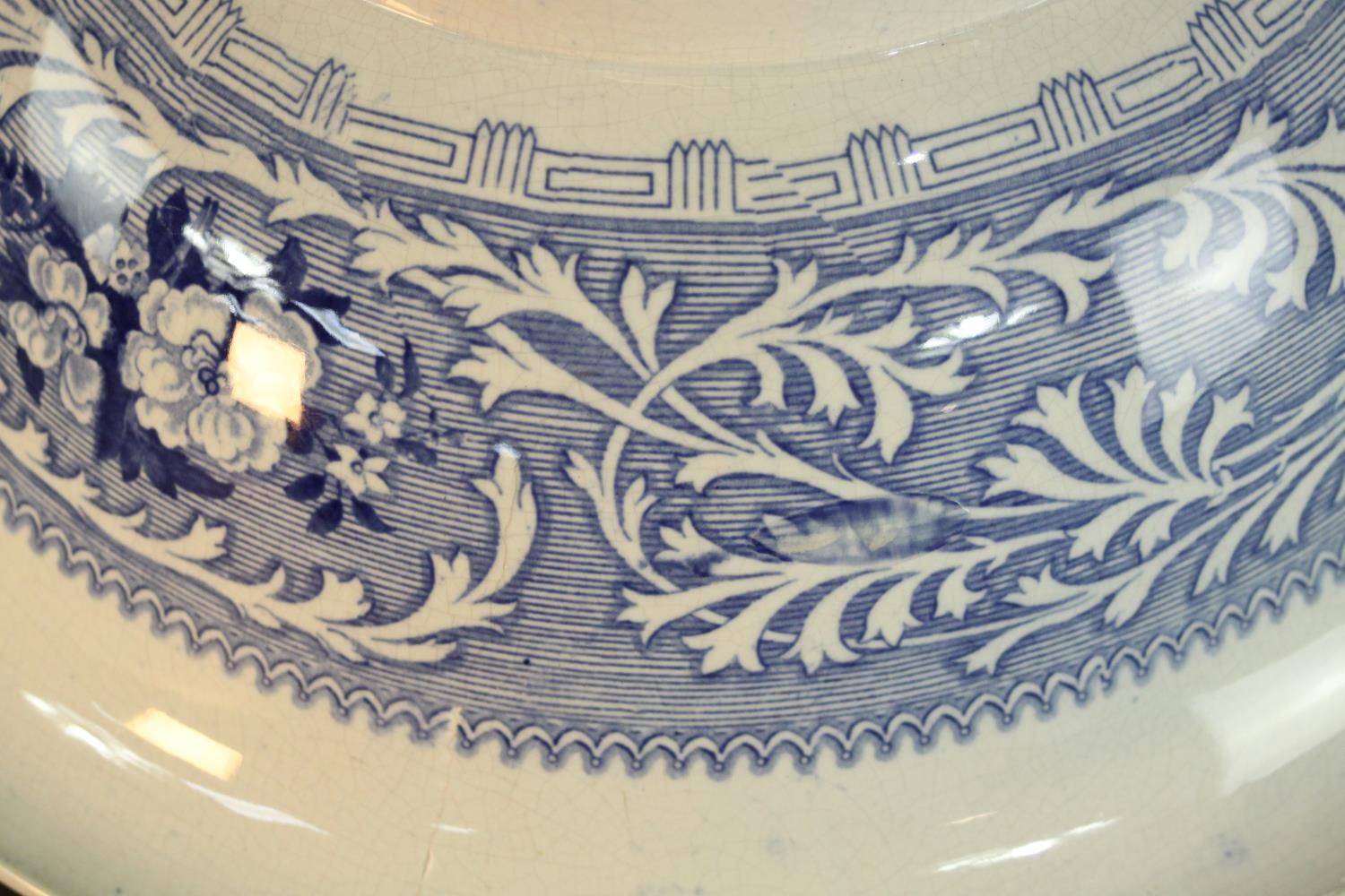 A Victorian Staffordshire blue and white china wash jug and basin, transfer printed with fantastical - Image 5 of 8