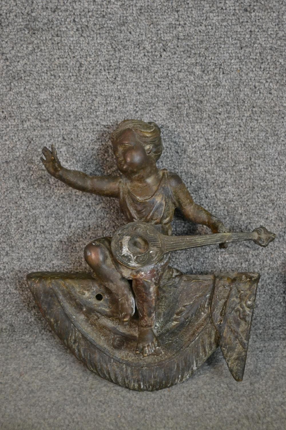 A pair of 19th century bronze finials in the form of putti musicians on swags. H.32 W.27cm - Image 3 of 5