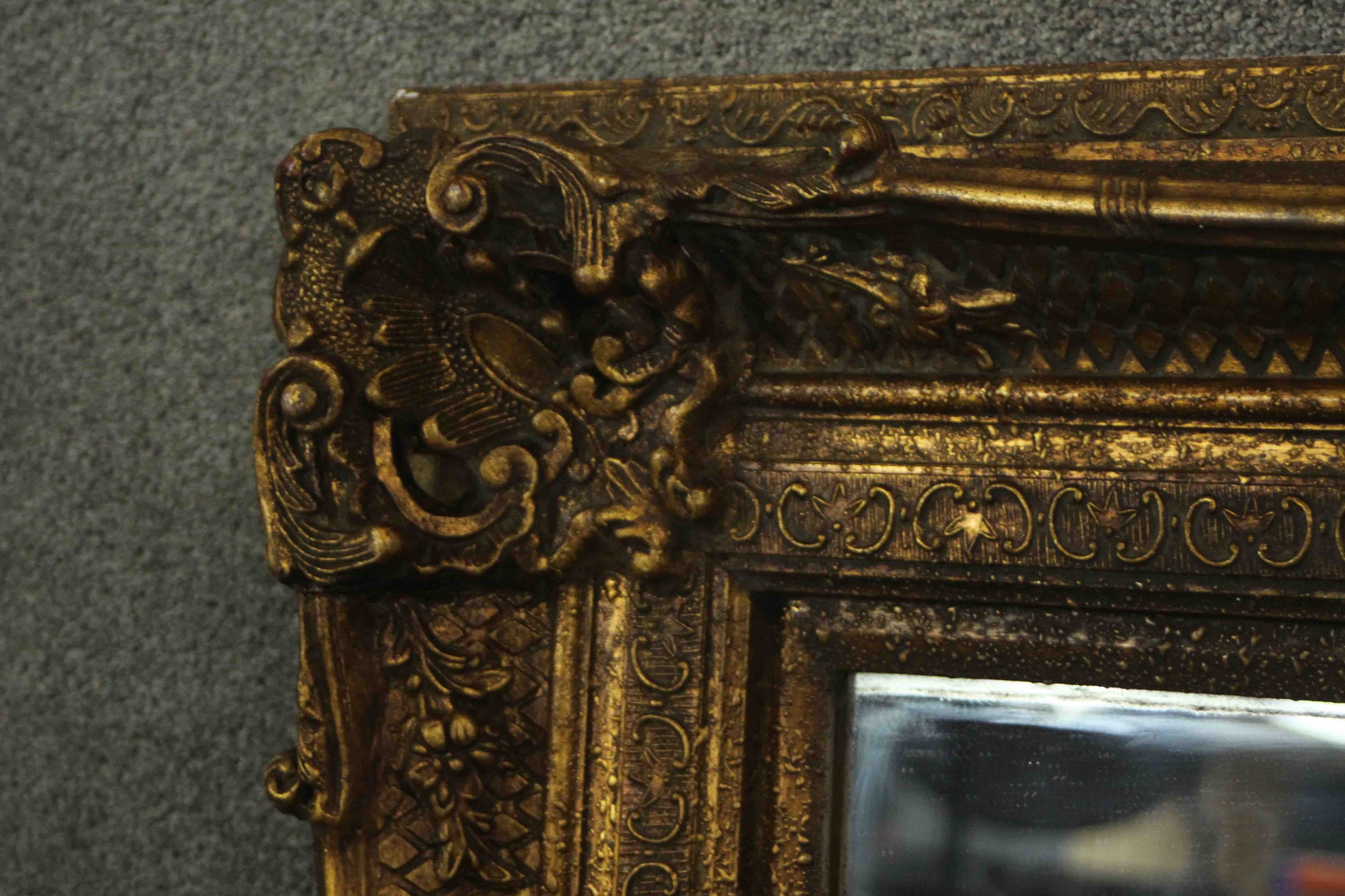 A large and decoratively framed gilt pier mirror in the Rococo style. H.160 W.220cm. - Image 4 of 9