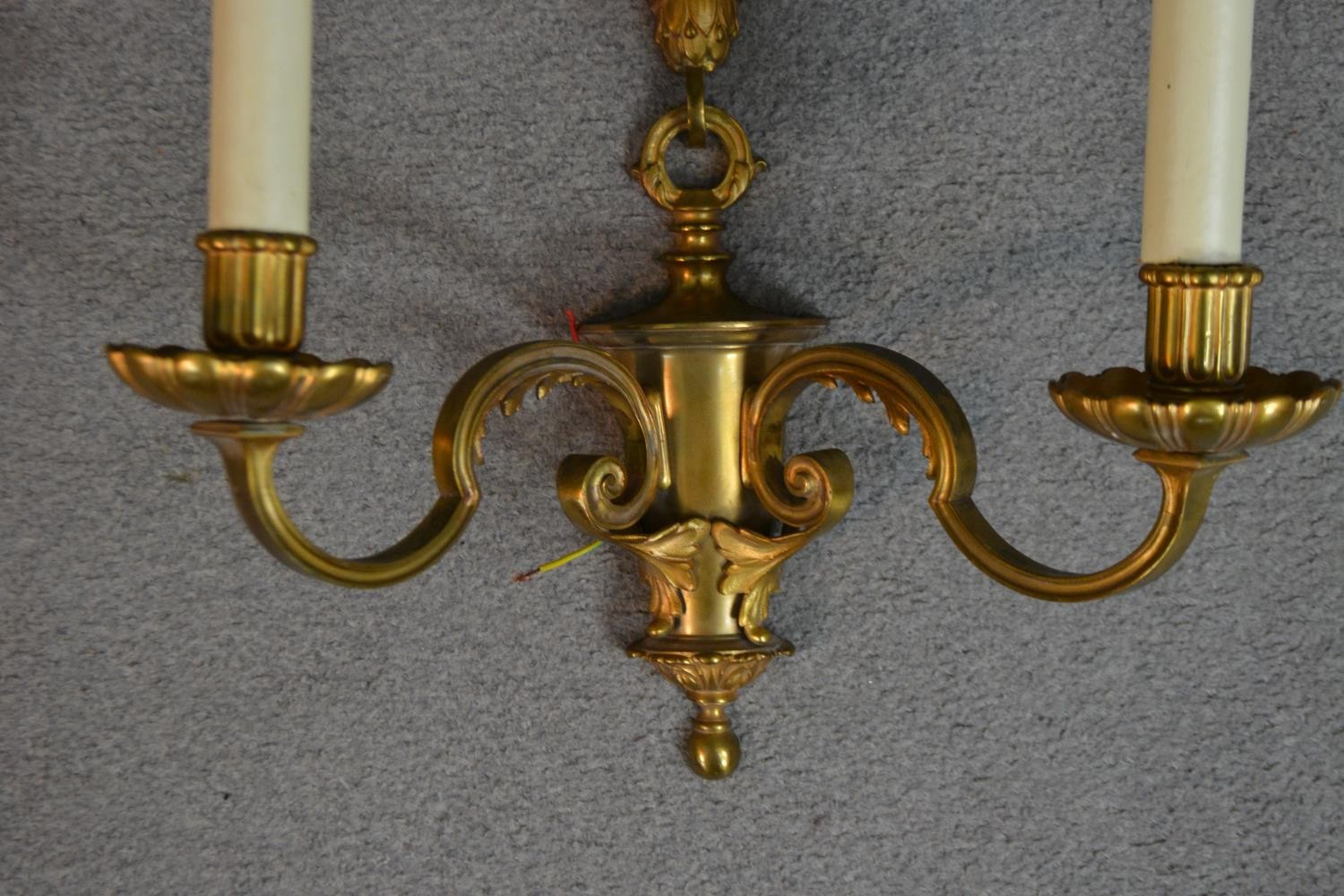 A pair of gilt metal two branch regency style wall sconces with laurel leaf and ribbon motifs. H. - Image 4 of 4