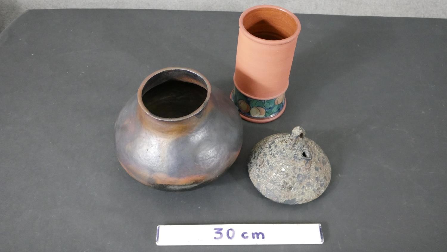 A collection of art pottery, including a gold crackle raku tea pot, a bronze glaze vase on three - Image 2 of 11