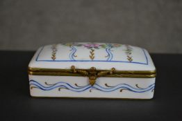 A Limoges porcelain hand painted trinket box with flower garlands and scrolling motifs. Inscribed