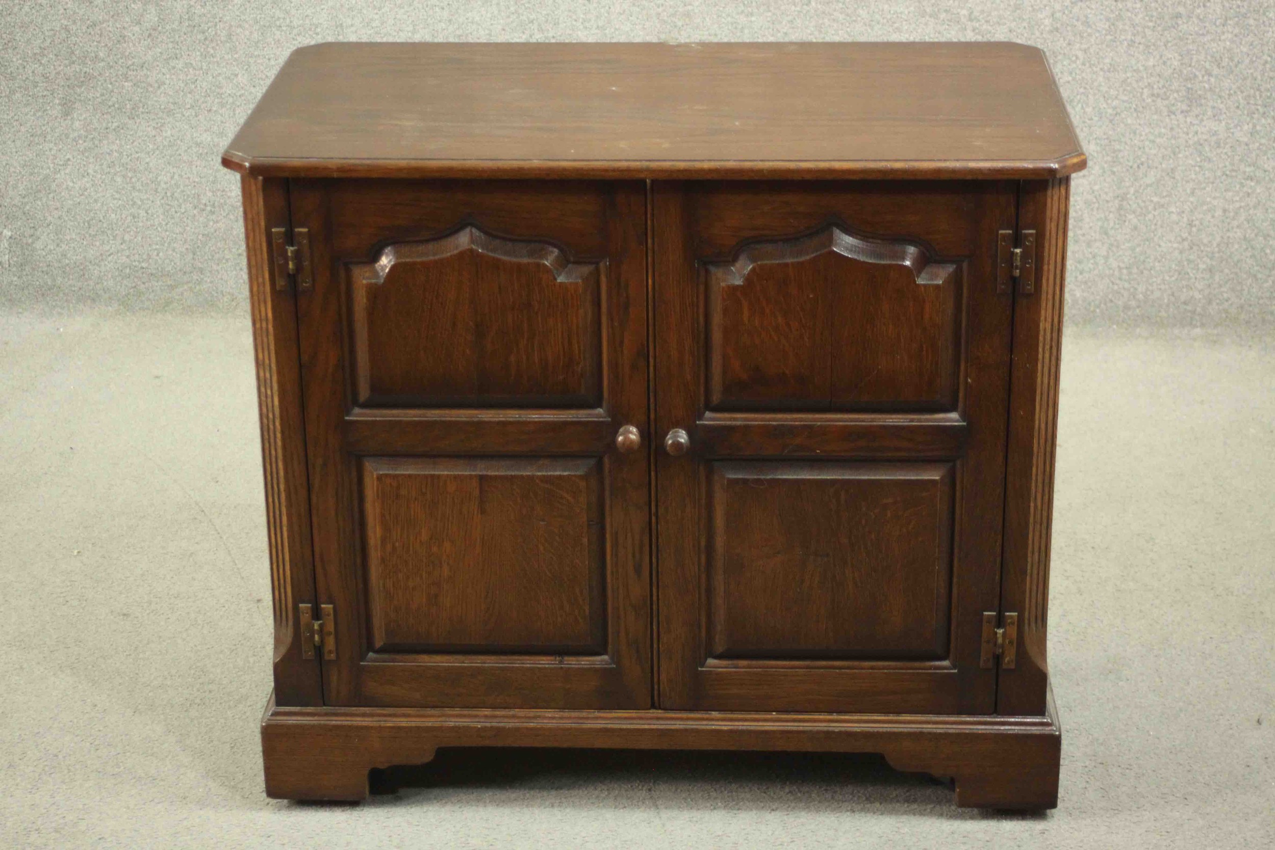 The Burley Butler; an oak heated sideboard electric food warmer, with a rising lid and two