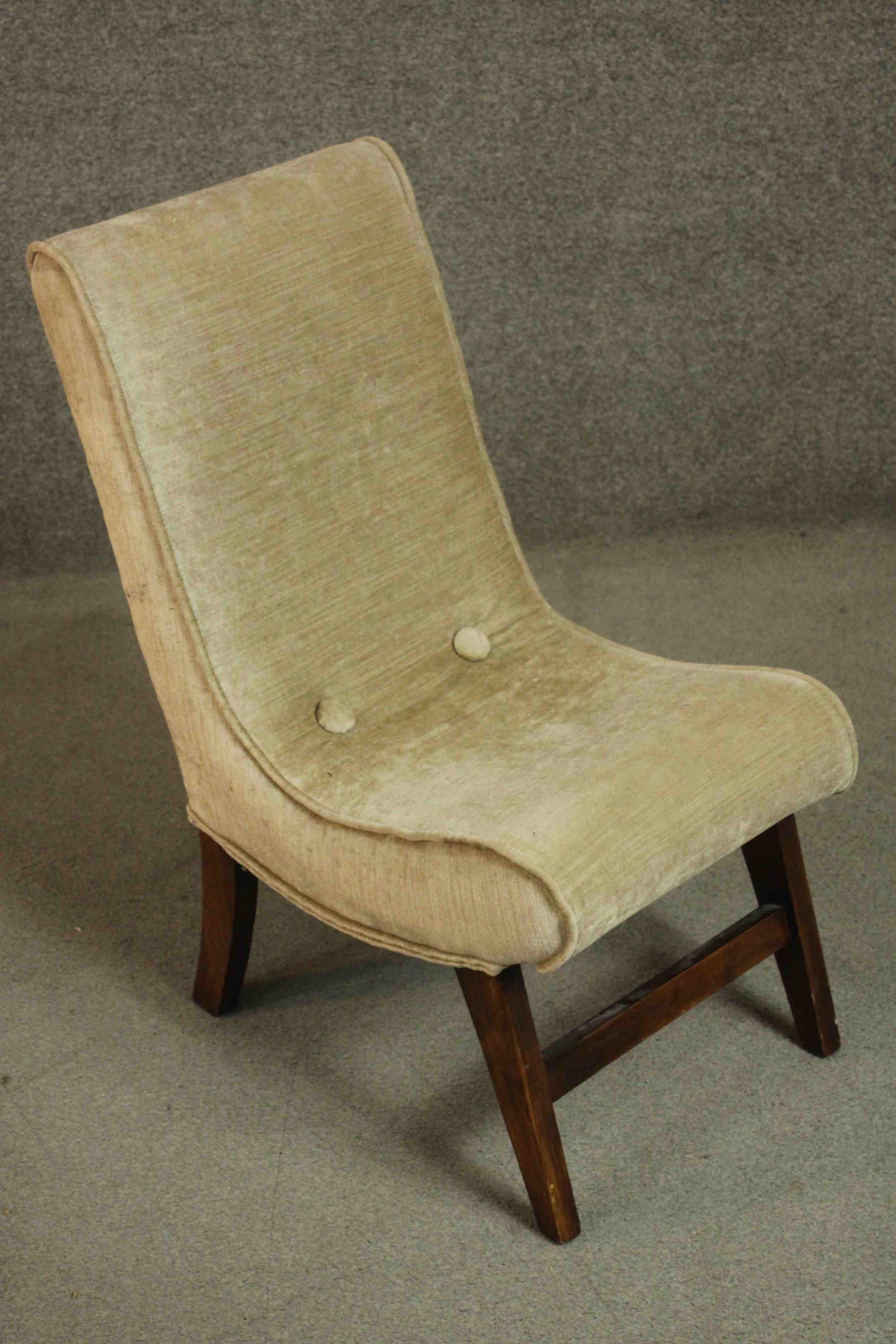 A circa 1960's nursing chair upholstered in gold coloured velour on mahogany legs joined by a - Image 3 of 4