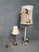Two contemporary lamps, including one gilt with a lobed glass section and a cream shade. H.83 W.