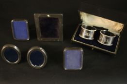 Five silver miniature easel photo frames and a pair of boxed silver napkin rings by Martin Hall & Co