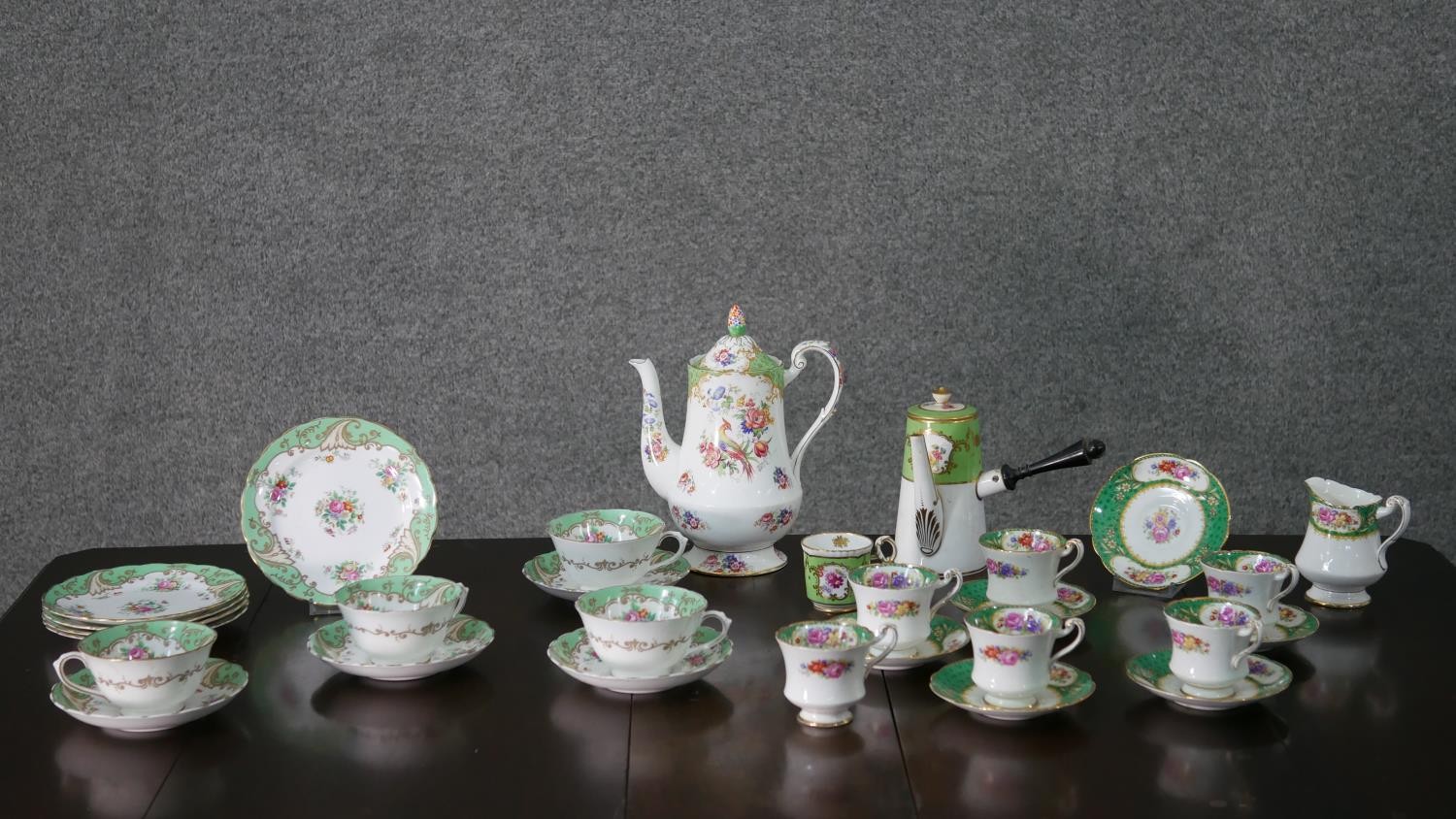 A T Goode & Co hand painted coffee pot and coffee cup, decorated with floral and gilded scrolling