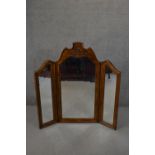A Continental style walnut framed folding triptych dressing mirror. H.133 W.131cm