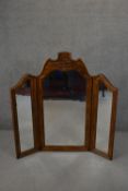 A Continental style walnut framed folding triptych dressing mirror. H.133 W.131cm