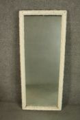A tall late 19th century pier mirror the moulded frame white painted. H.117 W.49cm.