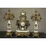 A 20th century Italian gilt metal clock garniture, the clock of lyre form with an enamelled dial