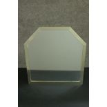 A modernist mirror of square form with canted top corners in a metal frame. H.52 W.50cm.