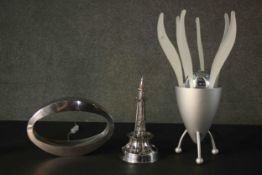 Three chrome lamps including, an oval polished finish lamp and a vintage Eiffel Tower lamp. H.51