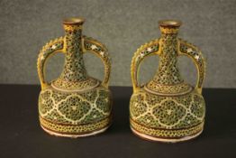 A pair of 19th century Zsolnay vases with double walls and reticulated mallet form. Decorated