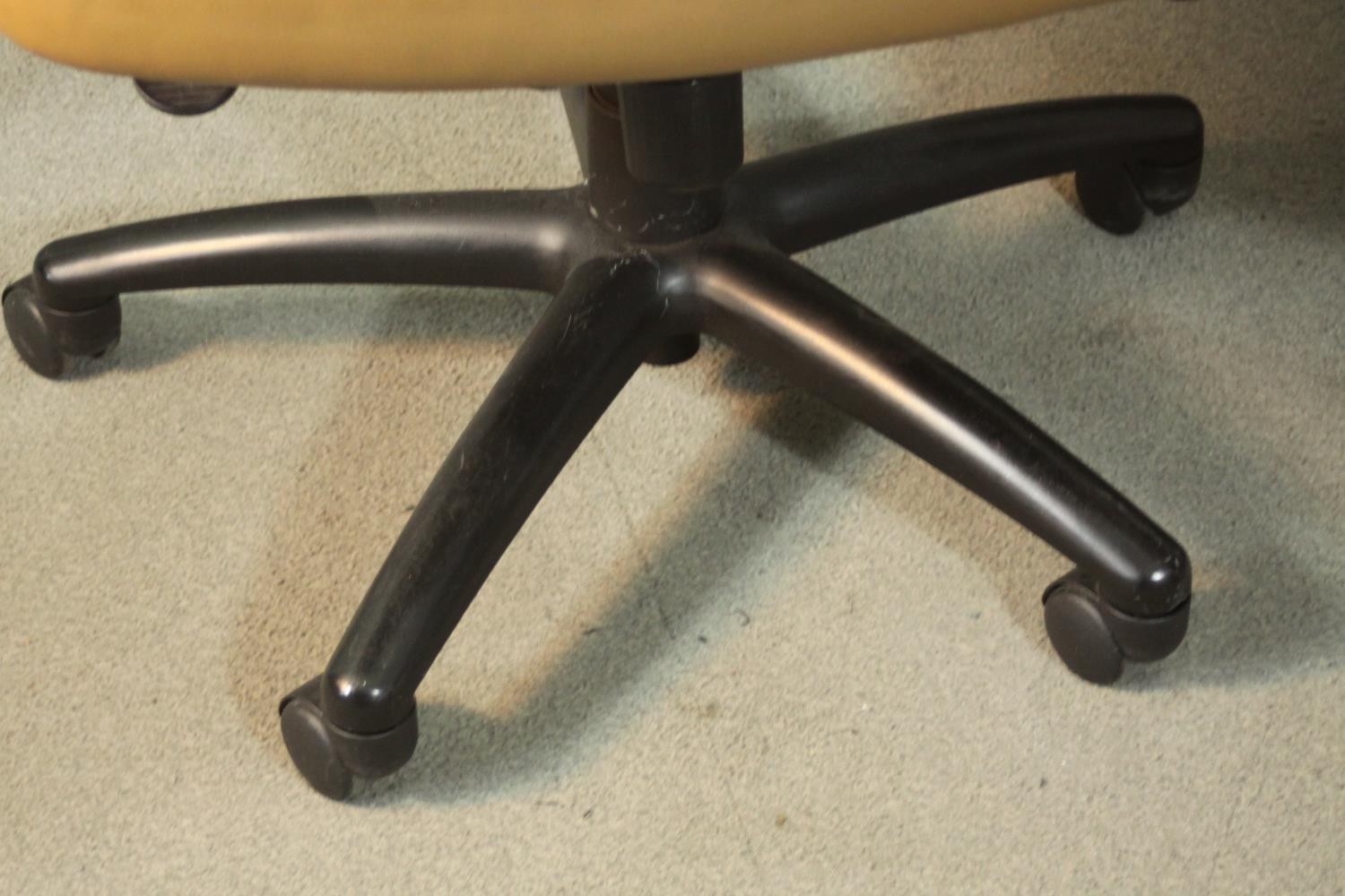 A pair of late 20th century tan leather swivel office chairs, of tub form, with a five point base on - Image 9 of 9