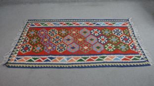 A red ground handmade Kelim L.183 W.105cm