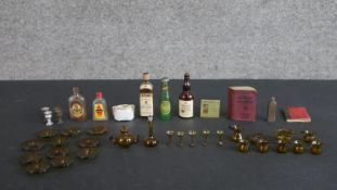 A collection of dolls house items and miniatures, including a set of hand-blown glass miniature wine