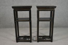 A pair of late 20th century Chinese black lacquered jardinière stands with a square top over an