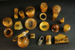 A collection of twenty early 20th century Mauchline ware souvenir items. Ring box, money box, sewing