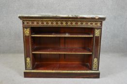 A 19th century rosewood bookcase with a rectangular marble top over a gilt metal mounted body and
