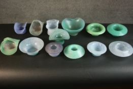 A collection of twelve marble blue and green art glass dishes and baskets. Some signed Vasart. (2)