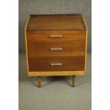 A circa 1960s Stag Furniture teak bedside chest, with a three quarter gallery over three long