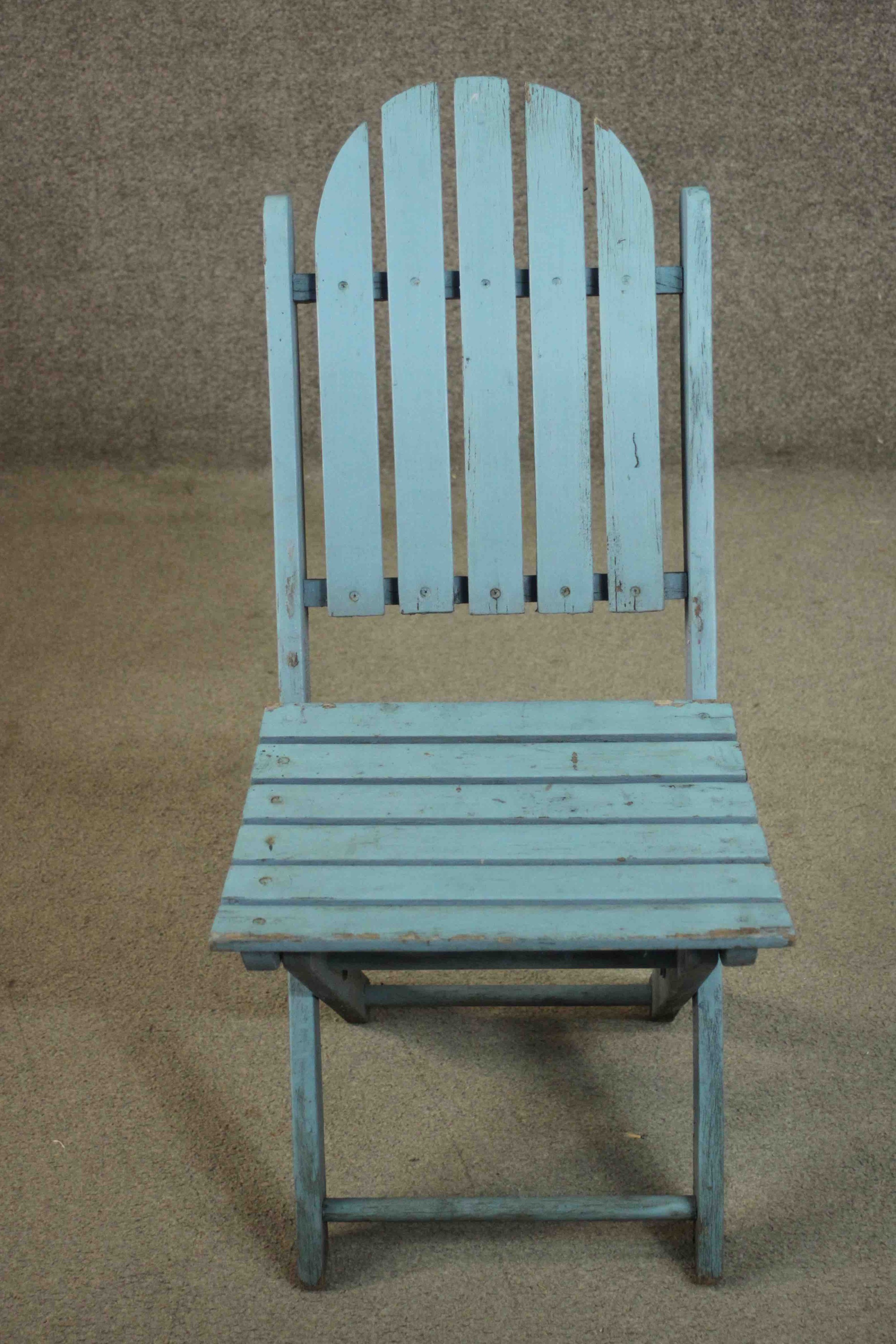 A set of four blue painted folding garden chairs with slatted backs and seats. - Image 2 of 7