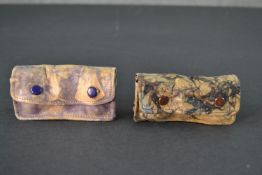 Two pairs of vintage marbled leather opera glasses with suede cases. W.9cm