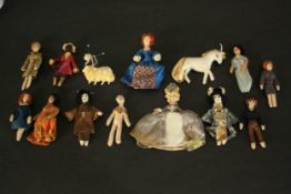 A collection of fourteen antique handmade fabric dolls and animals. L.23 W.18cm. (Box)