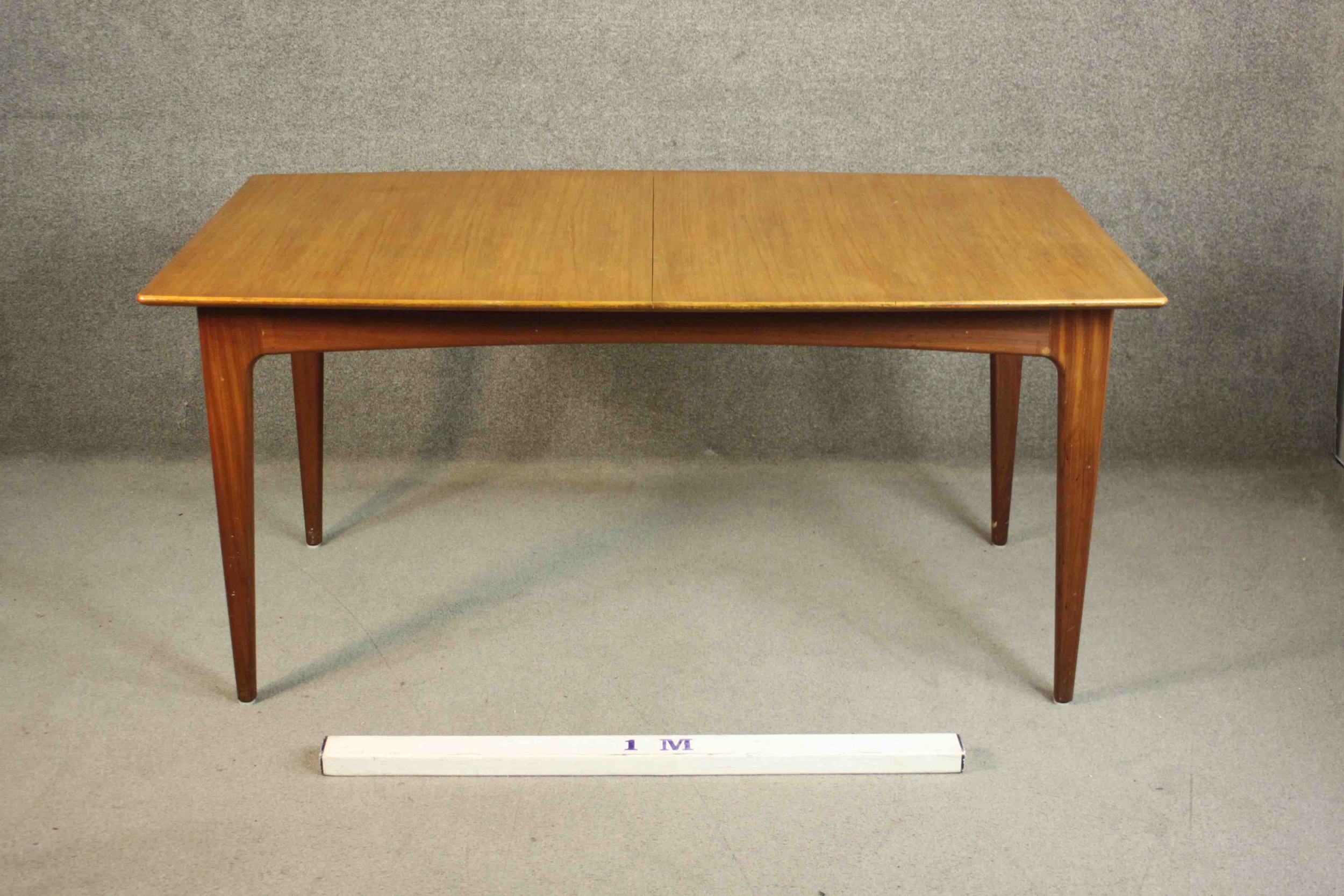 A circa 1960s teak extending dining table, of rectangular form with an additional leaf, on - Image 2 of 10