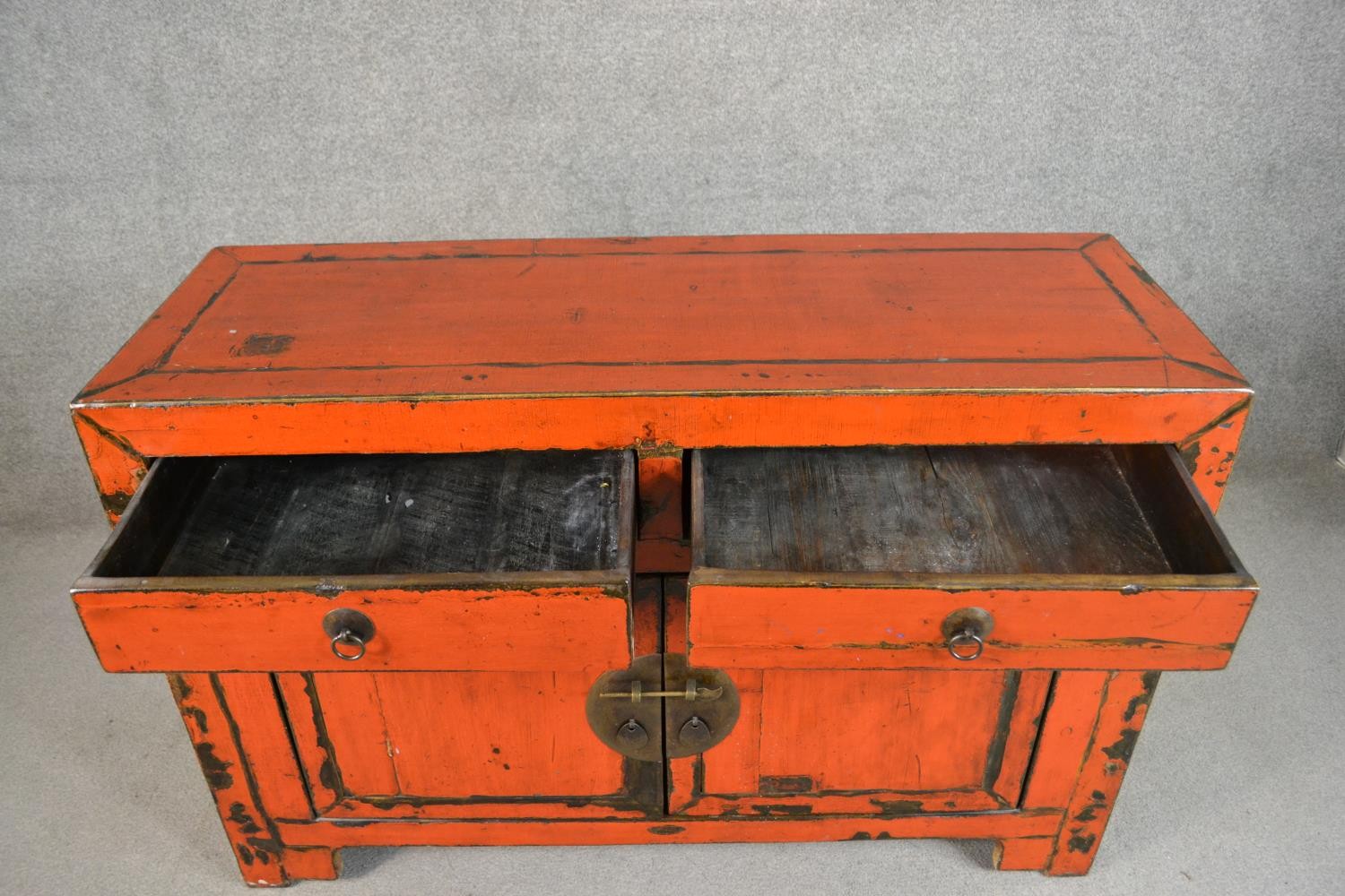 A 20th century Chinese red lacquered sideboard, with two short drawers over two cupboard doors. H.84 - Image 4 of 5