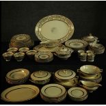 A Johnson Brothers Victorian pattern dinner service with gilt bands on a cream ground along with a