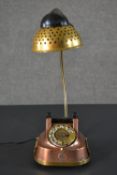 A vintage copper dial up telephone converted into a novelty desk lamp. H.40 W.48cm
