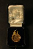 A leather cased Victorian 18 carat National Angling Club 1880 medal with engraved lettering and