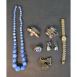 A collection of silver and costume jewellery including a blue opalescent glass necklace, a silver