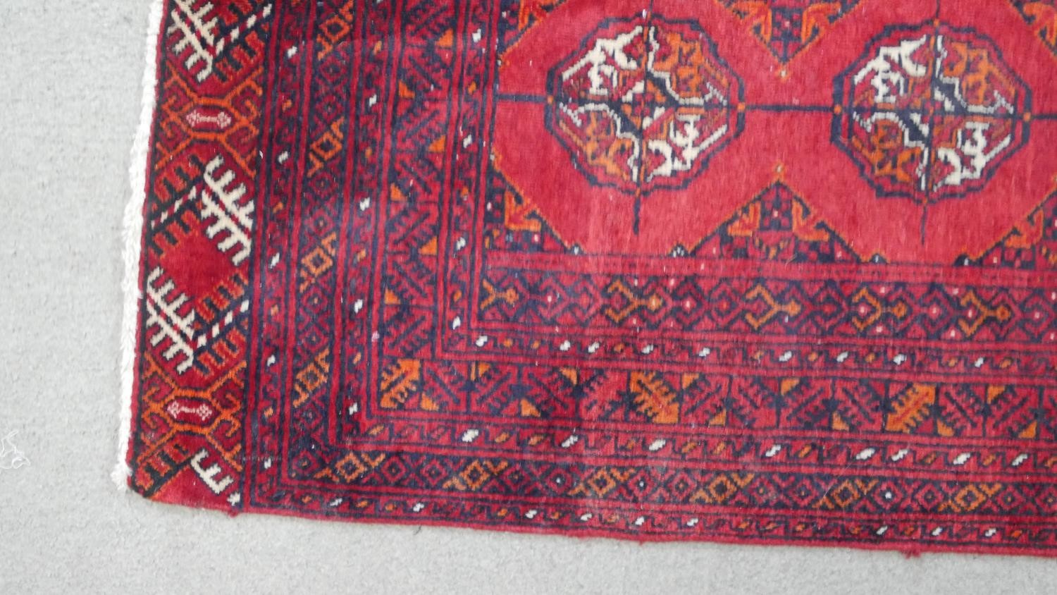 A red ground handmade elephants foot motif Persian Yamut rug. L.153 H.108cm - Image 5 of 5
