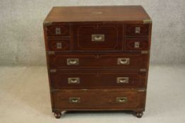 A Georgian style mahogany TV cabinet with faux military style lift up front. H.90 W.81 D.57cm.