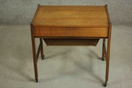 A circa 1960s Danish Vitze teak sewing table, of rectangular form with a fitted drawer, over a well,
