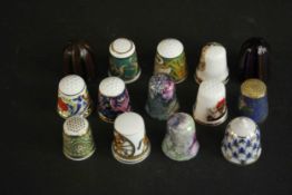 A collection thimbles, including a hand painted Royal Crown Derby thimble, two hand blown Murano