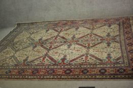 A handmade fawn ground Persian Ardebil carpet. L.300 W.230cm.