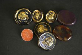 Five Bimini style pressed gold and black buttons with a classical profile with fish (three large and