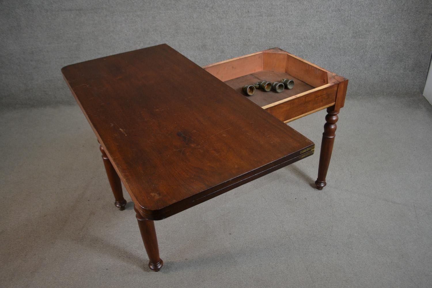 A Victorian walnut tea table of rectangular form with a fold over top on turned legs. H.70 W.116 D. - Image 5 of 6